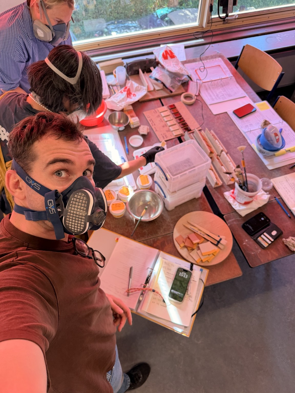 Michael wearing a respirator at a glaze workshop